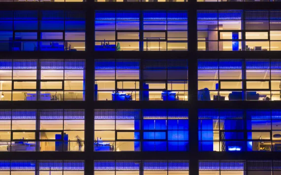 Office building with illuminated workspaces